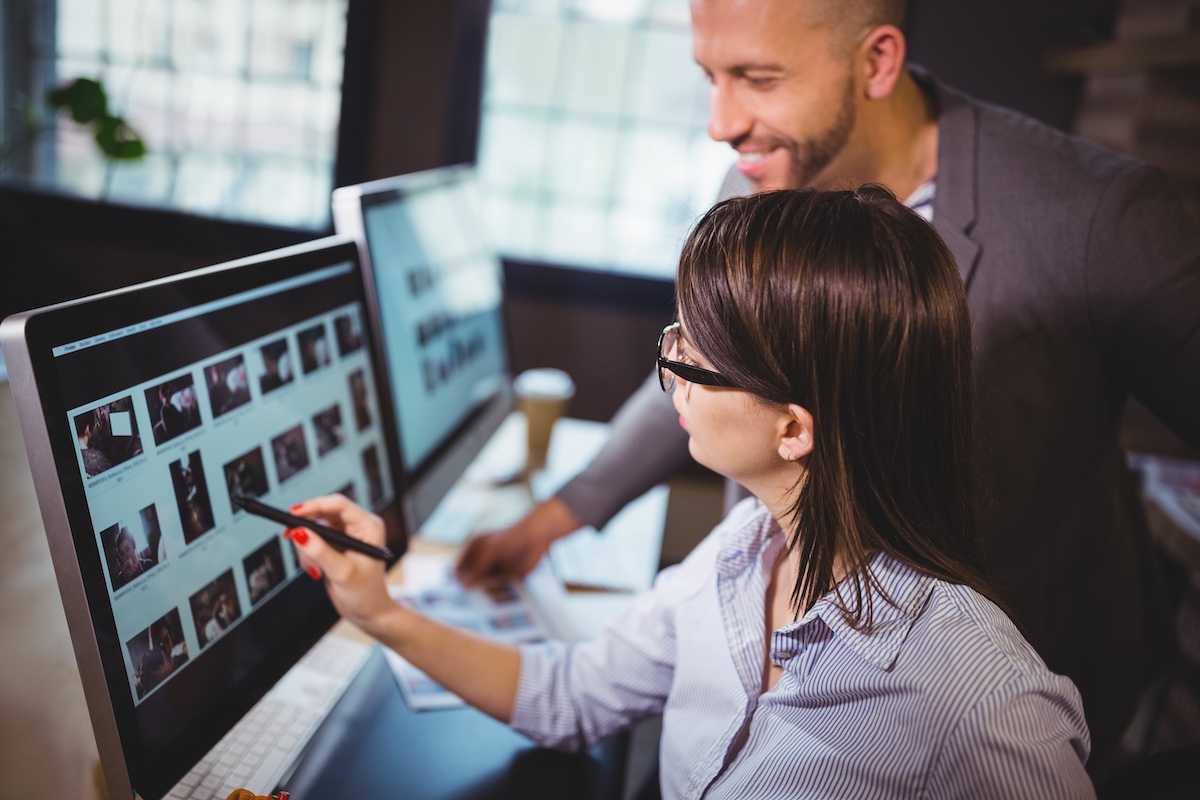 Digital advertising professionals working with campaign content